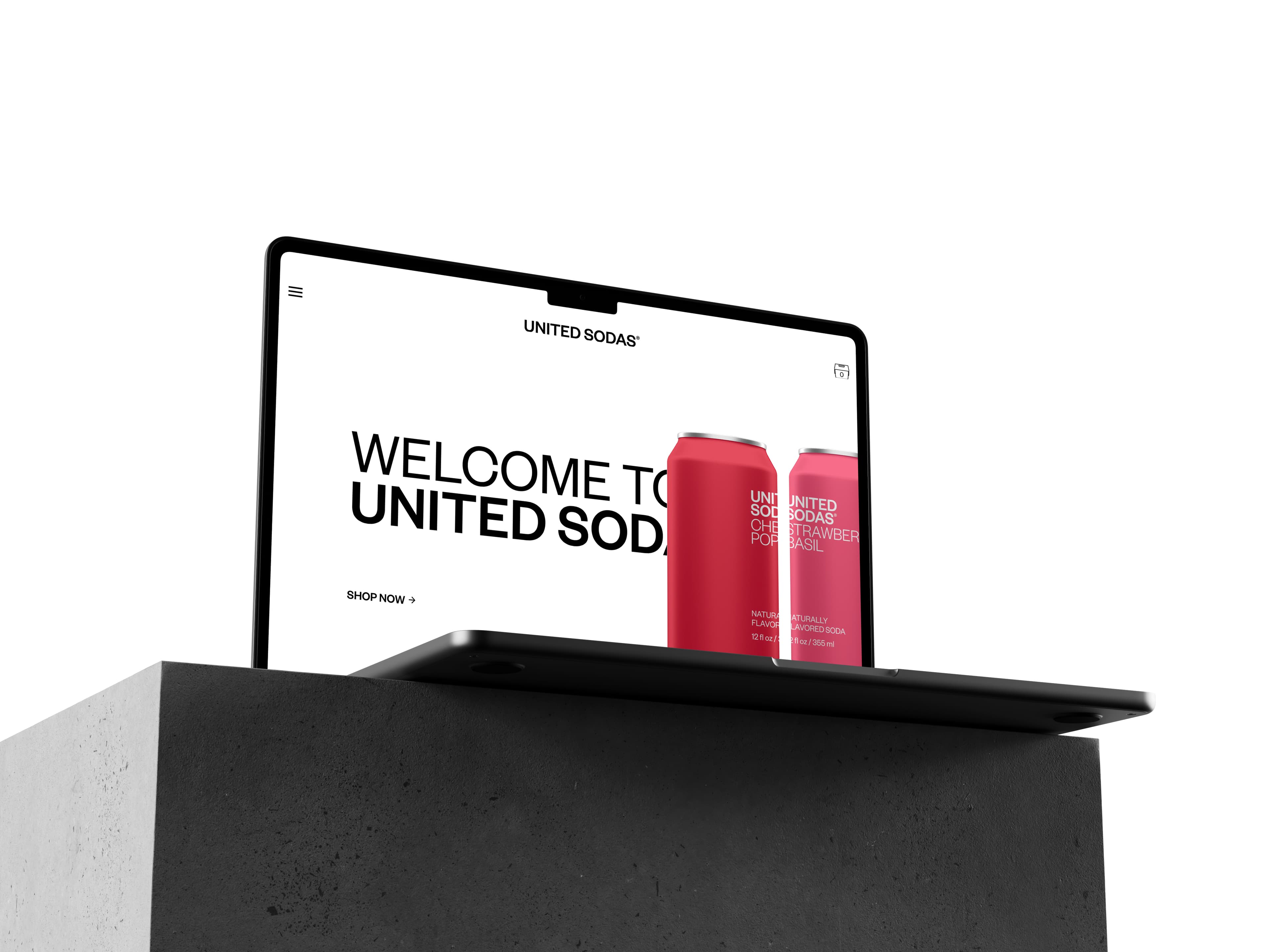 United Sodas Shopify homepage on a laptop, with Cherry Pop and Strawberry Basil cans
